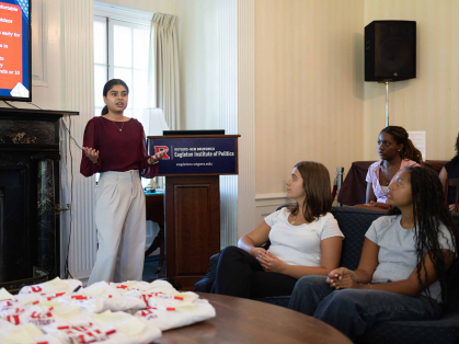 Rida Kadri (left) leads a training session for RU Voting ambassadors in Wood Lawn Mansion.