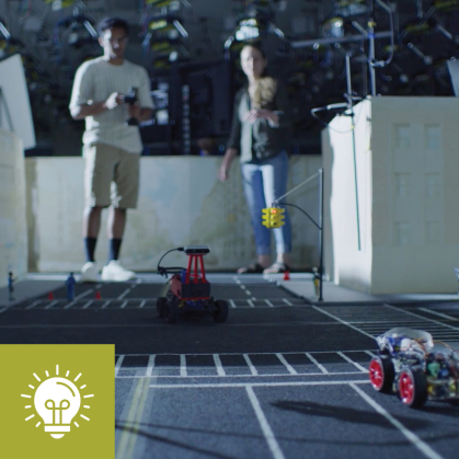 Two robots race on a track