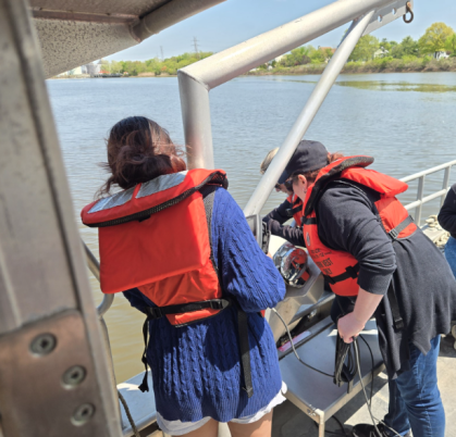 Students in Carrie Ferraro's course on a boat in the Raritan River.