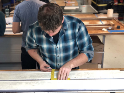 A researcher measuring and pegging the core.
