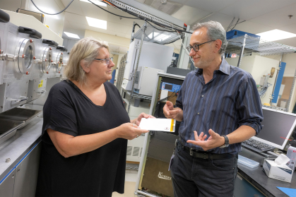 Glenn G. Amatucci (SOE ’92 ’93 ’95), Professor of Material Sciences and Engineering, works with (l.) Anna Halajko, Laboratory Researcher I, in his lab at the Energy Storage Research Group.