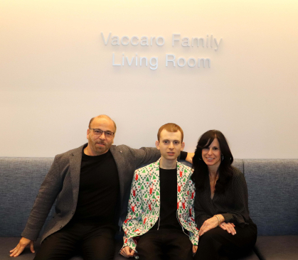 John Vaccaro and his family in front of the John Vaccaro living room