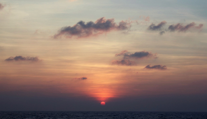 The sun sets over the Bay of Bengal.