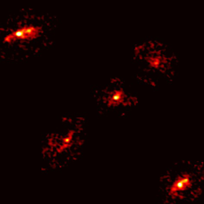 Five red blobs of light against the black of deep space
