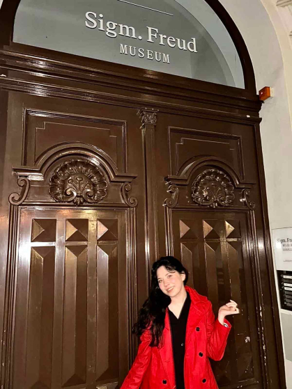 Rutgers-New Brunswick graduate Emily Trujillo stands before the doors of the Sigmund Freud Museum in Vienna in March.