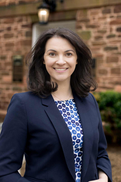 Francine Glaser smiles and stands outside Old Queens at Rutgers-New Brunswick..