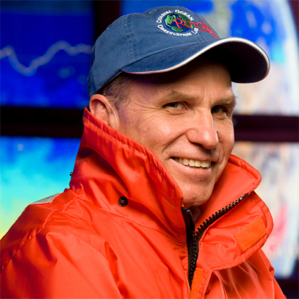 Man in blue cap and orange jacket