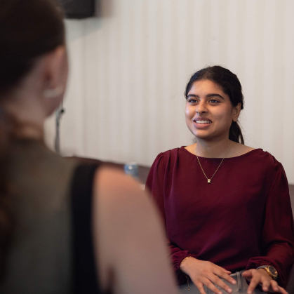 Rida Kadri (right) speaks with an RU Voting ambassador during a training session in Wood Lawn Mansion.
