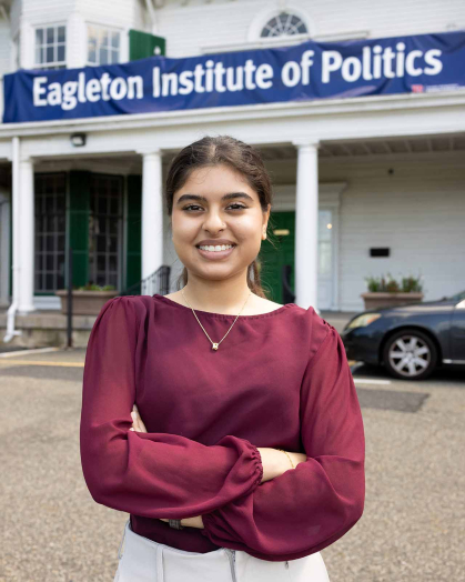 Kida Kadir stands outside of the Eagleton Institute of Politics at Rutgers-New Brunswick.