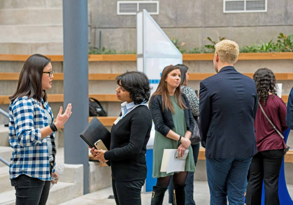 Students visit with company representatives during a “Campus to Career Field Trips” event.