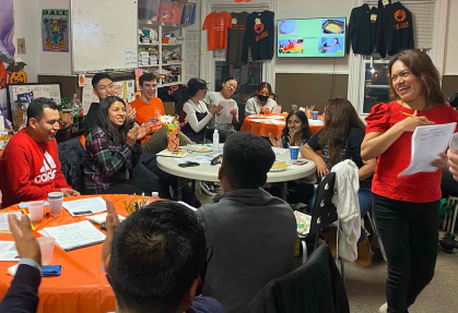 Rutgers students involved in The Conversation Tree program and members of nonprofit group New Labor take part in a language practice activity in December 2022.