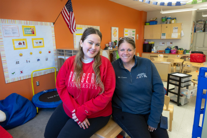 Rutgers junior Ara Spielman, left, works in Debra Coates, a special education teacher at Paul Robeson Community School for the Arts.