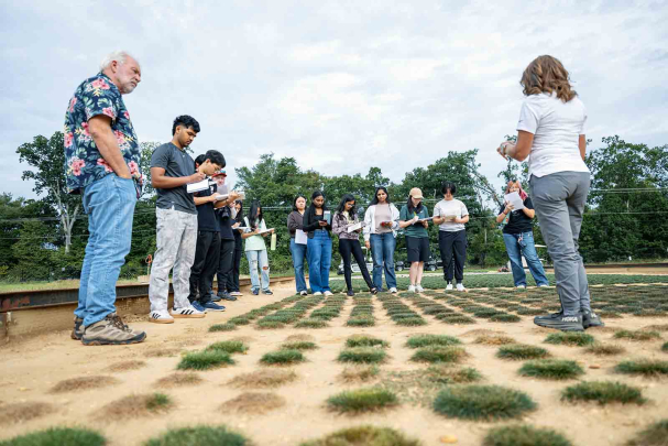 Rutgers professors Peter Oudemans (left) and Stacy Bonos (right) lead a class of Honors College students visiting Adelphia Farm, in Freehold, N.J.