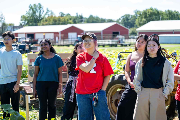 Jen Kim (center) and other Honors College students listen to Peter Nitzsche, director of Snyder Farm.