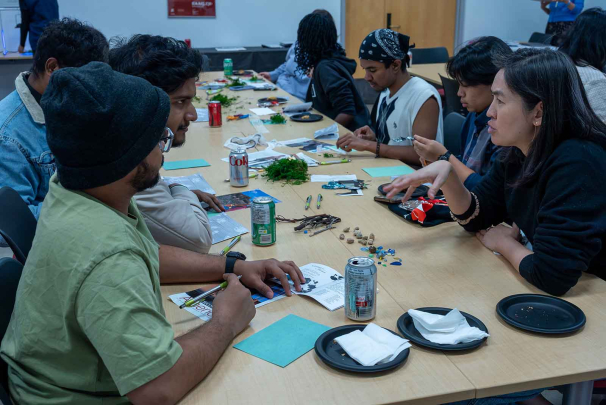 Assistant professor Sue Huang (left) talks to students participating in a botanical workshop held in the Zimmerli Art Museum.