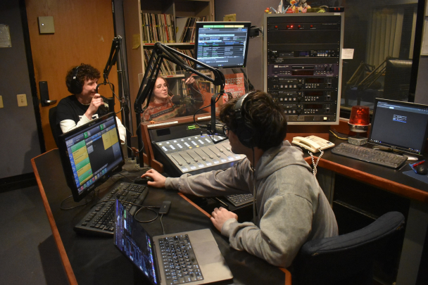 Three students hosting a radio show at 90.3 The Core
