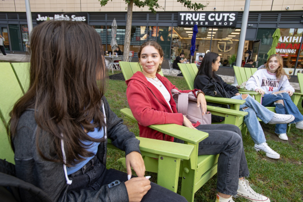 Bianca La Fata (SEBS ’25), Alexis Salamon (SAS ’24), and Patricia Ranone (SEBS ’26) enjoy a fall day sitting at The Yard on the College Avenue campus.