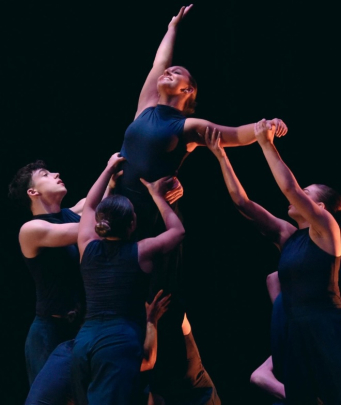 Students from Rutgers Mason Gross School of the Arts perform choreography on stage