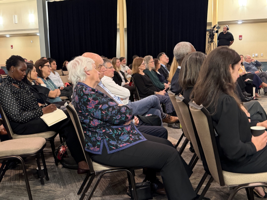 A room of people seating during a Bridging Minds event