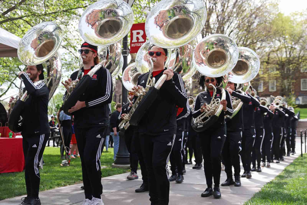 Members of the Scarlet Knights Marching Band perform on Voorhees Mall during Rutgers Day 2024.