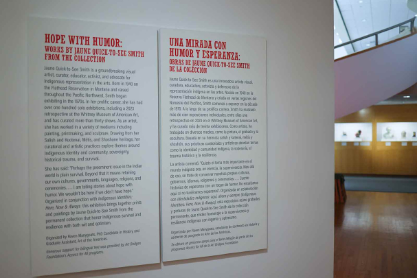 A gallery wall inside the Zimmerli Art Museum features English and Spanish text.